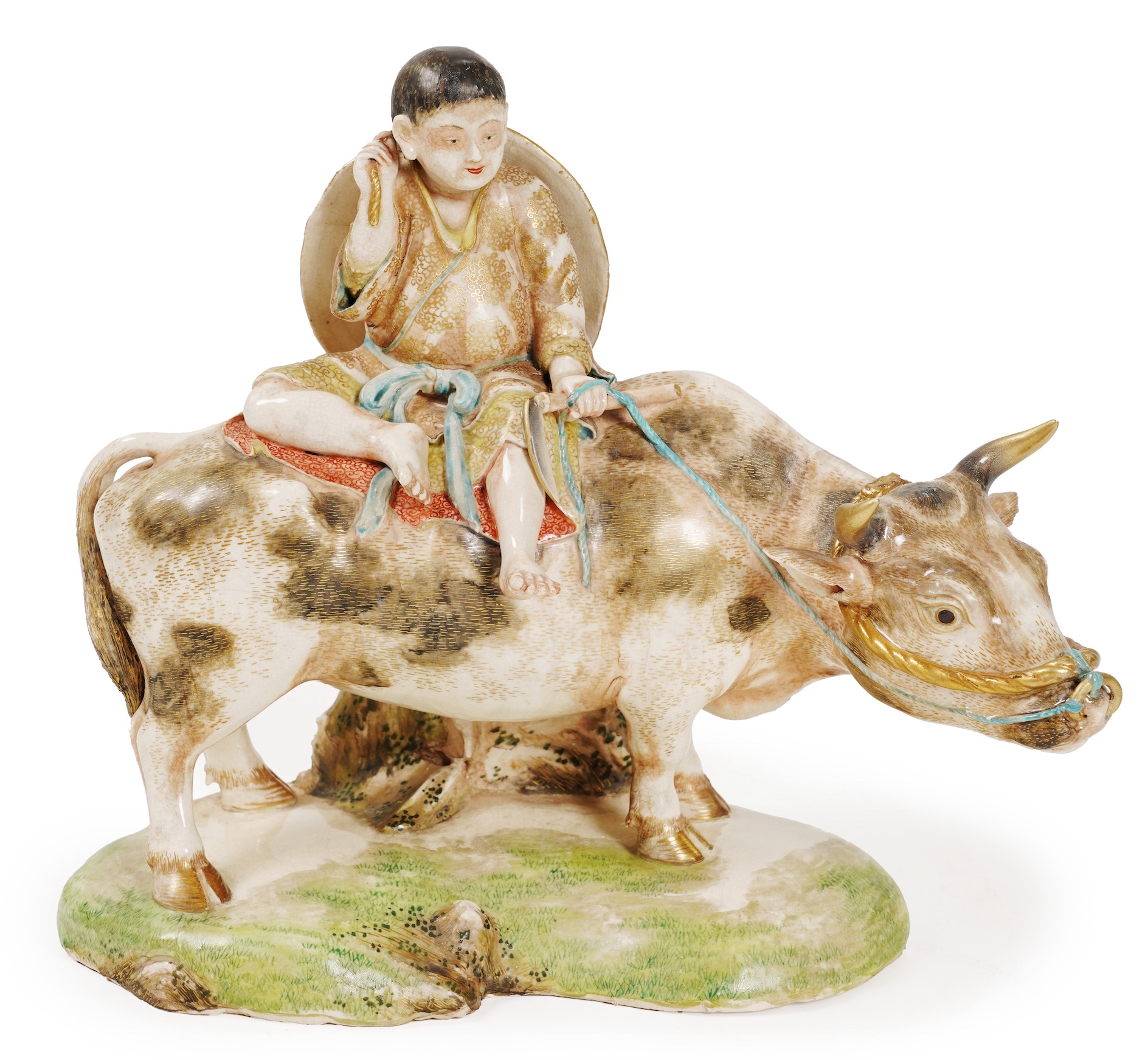 A large Japanese Satsuma model of boy riding on a buffalo, signed Hozan, Meiji period